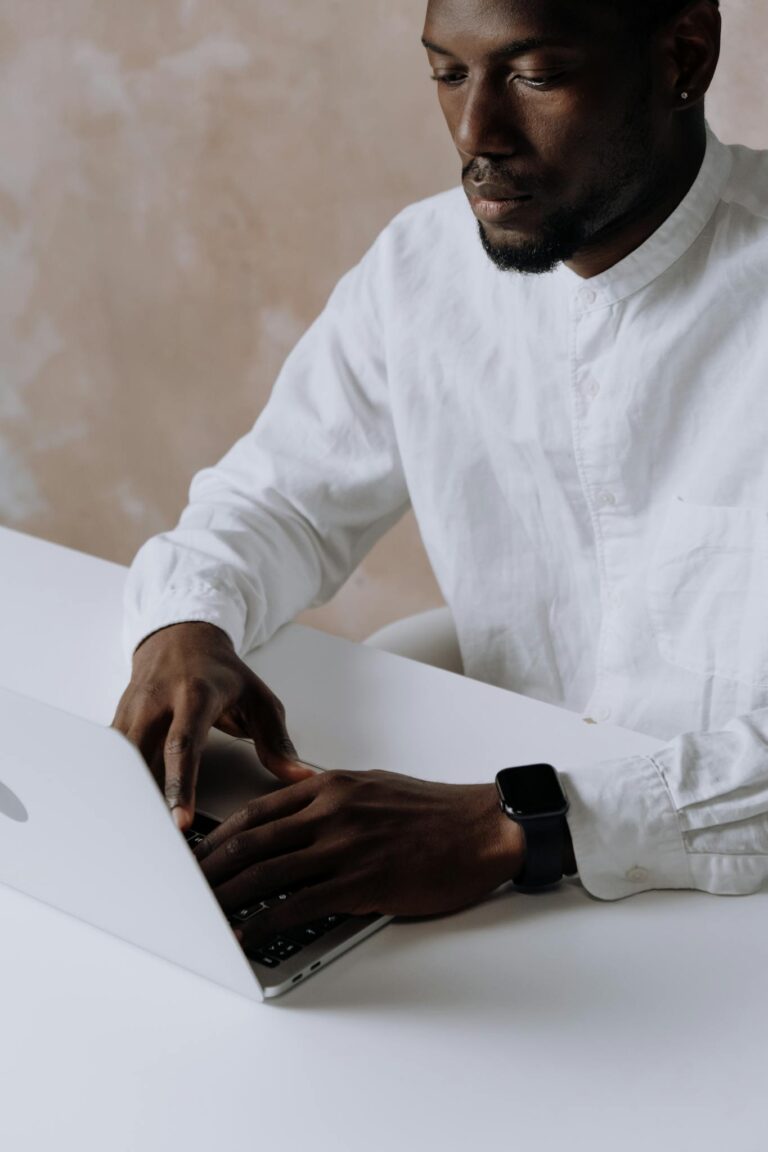 Man in White Dress Shirt Wearing Black Watch