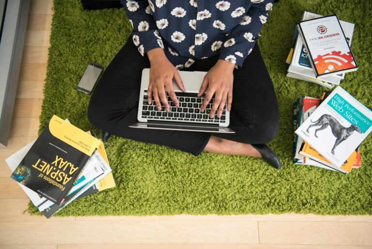 Person Holding Macbook Flatray Photograph